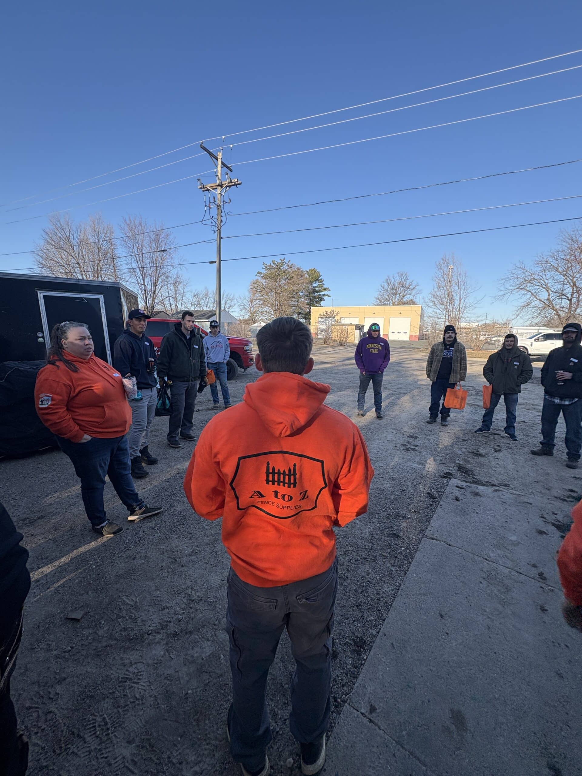 Fence installation training morning huddle as a full day of training begins